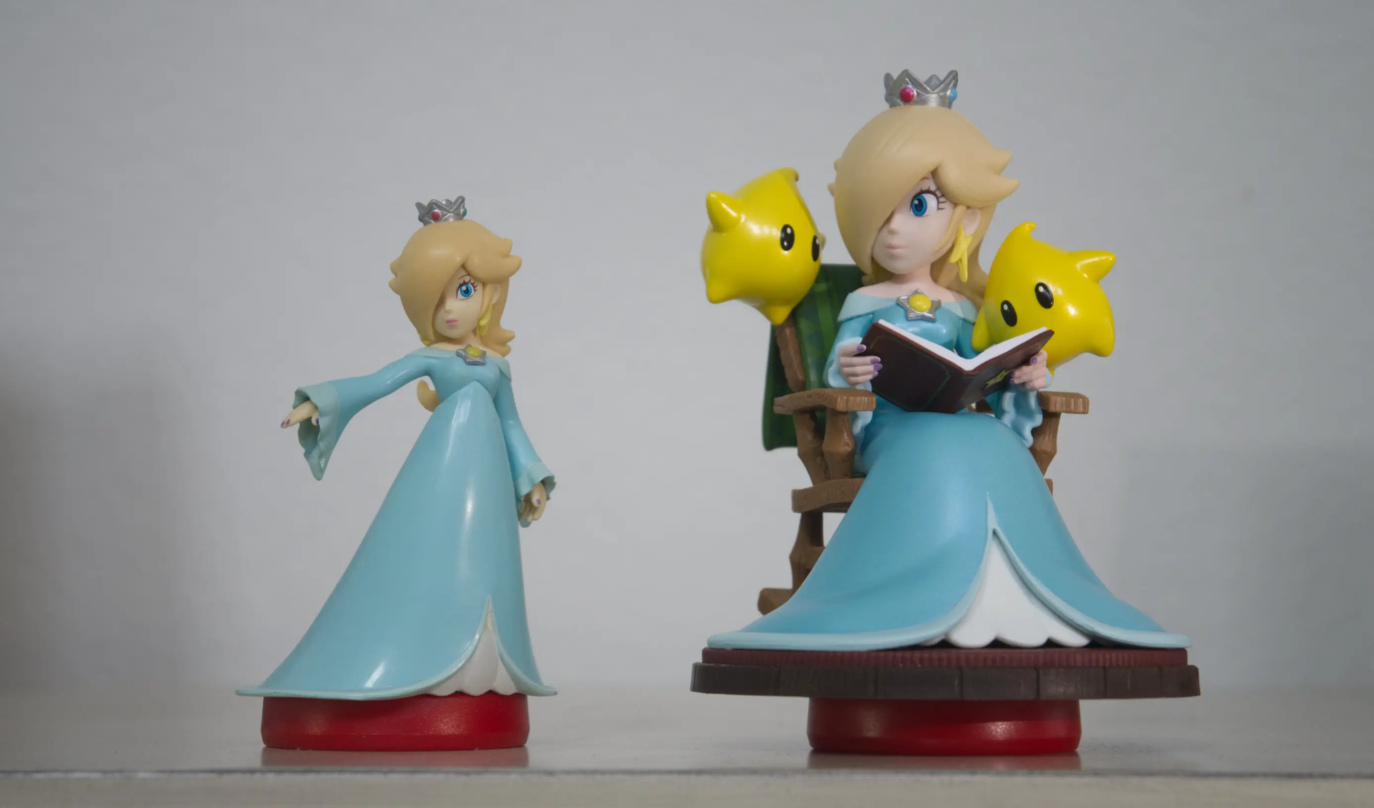 Left: A standard-sized Super Mario series Rosalina amiibo. Right: The larger Super Mario Galaxy series Rosalina and Lumas amiibo